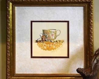 framed print of a teacup