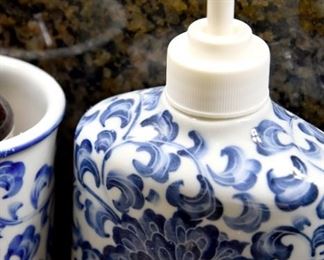 blue and white ceramic soap dispenser