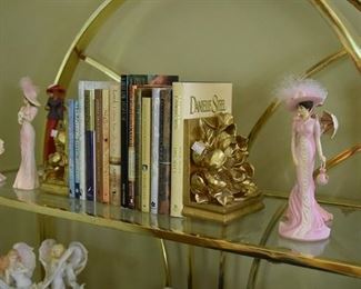 books, dolls, brass display case, bookends