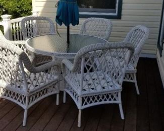 Wicker porch set with cushions; rockers also available
