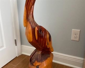15.   James Darling • Pelican wood-carved statue •35"H 10"across • $150