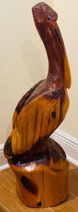 15.   James Darling • Pelican wood-carved statue •35"H 10"across • $150
