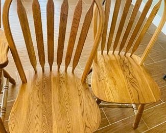 20.   Oak chairs • 2 armed chairs, 2 armless chairs • 45"H x 24"W x 23"D • $140