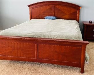 22.   Contemporary King Bed with nightstand • includes mattress • mahogany finish with nickel hardware • bed 58"H x 84"W x 87"D • nightstand 28"H x 28"W x 18"D • $350