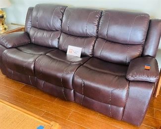 28.   Power reclining sofa • 42"H x 90"W x 38"D • $450