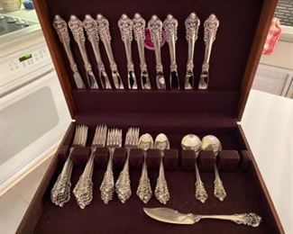 $1,400 Grand Baroque Sterling flatware in box 10 knifes, 10 dinner forks, 12 salad forks, 9 teaspoons, 3 serving pieces. Total 44 pieces and 58.15 oz. 