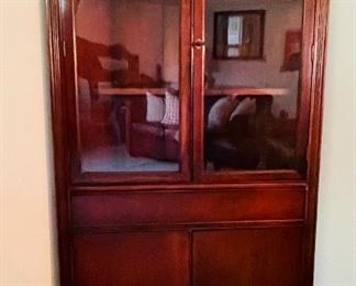 12.   Mahoghany corner cabinet • 68"Hx33"Wx27"D • $240