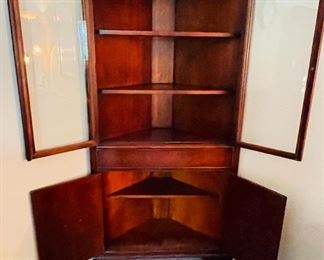 12.   Mahoghany corner cabinet • 68"Hx33"Wx27"D • $240