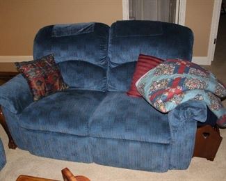 Sofa and loveseat are blue fabric in very good condition