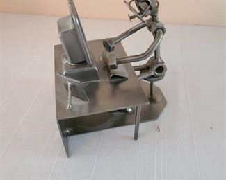 Metal figurine made of nuts and bolts