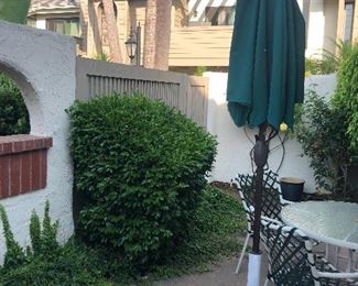 Green canvas garden umbrella  and Brown Jordan style patio 