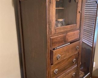 Vintage wardrobe repurposed into a gun cabinet