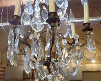 One of several stunning French gilt brass chandeliers with large crystals