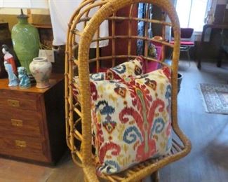 Fantastic rattan/bamboo swivel chair and luxe designer pillows
