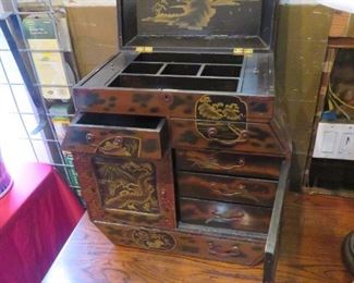This Chinese gilt lacquer chest has lots of hiding spaces and allows for maximum organization!