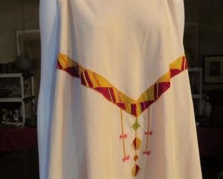 This rare offering is beautifully hand embroidered and has a cut that would be flattering to any body!