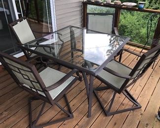 Patio table with four chairs glass top