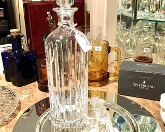 Beautiful Baccarat decanter and mother of Pearl reticulated fish can opener.