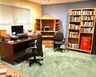 Upstairs landing with more books, office supplies, desks and corner cabinet great for kids. 
