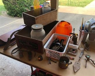 crates, vintage jars and bottles, primitive tools, razors, 