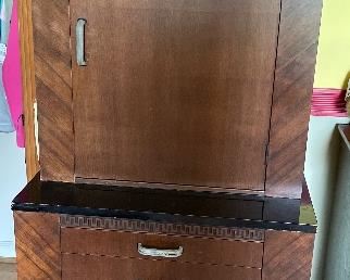 Lighted cabinet with glass shelving. 