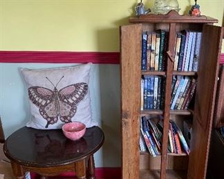 Small cabinet end table and books 