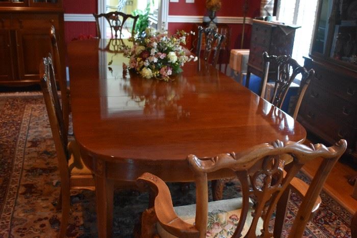 Gorgeous Dining Room Table and 8 Matching Chairs with Beautiful Needle Point Chairs in Chippendale Style.