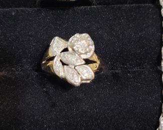 Top Ring is 14k White Gold with a 1/2 Carat Diamond in center I1-SI2 and F in color.... The Center Ring (in this pic) larger Diamond is .20 Carat set in 14k Yellow Gold