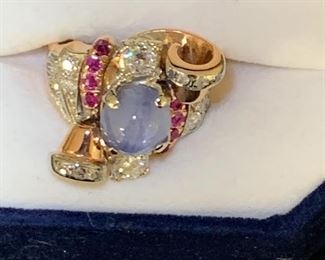14 k rose gold with 9mm Star Sapphire , eight 2.5 mm round cut rubies sand 1.35 cart total weight round diamonds. 
$1996.00