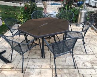 Metal table with 6 chairs, umbrella stand and cover