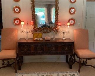 Beautiful English oak Jacobean carved sideboard, sold
carved gold leaf mirror,Sold
pair of crystal candelabra lamps, 6 French plates, sold
pair of armless upholstered chairs