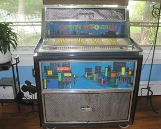 1965 Seeburg jukebox w/ 80 double sided 45 records. Plays well.