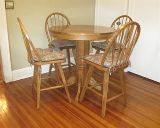 High oak pedestal kitchen table with 4 chairs.