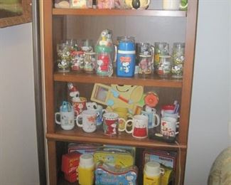 Bookcase with more Snoopy collectibles.