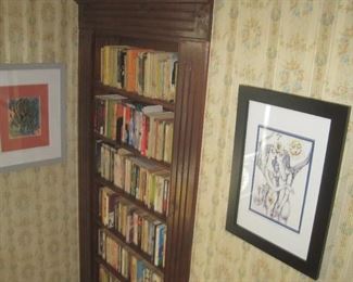 Assorted artwork and more books.