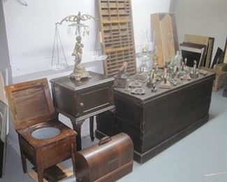 Child's commode, large wooden trunk, collection of antique irons.