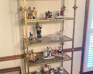 Unique Metal and Wood Shelving with figurines and glass displayed.
