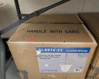 Three brand new in the box light fixtures