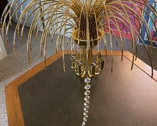 This is a waterfall Chandelier. The crystals will be located at the front desk. I put one Crystal on there so you can see what they look like. This is a stunning piece. Hollywood Regency at its finest