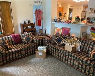 The sofa and loveseat they have would arms that match the end table and then nesting tables