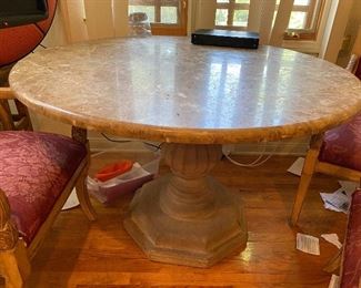 Round solid marble top on stone pedestal kitchen table