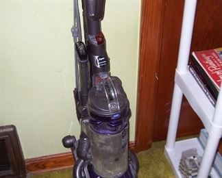 Dyson works good however, it does not "lock" in the upright position