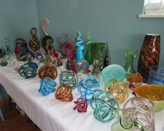 Many glass figurines, vases and rope knots
