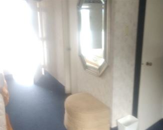 Many gilded octagonal mirrors and Ottomans  originally from Helmsley Hotel in Manhattan