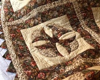 Handmade vintage quilt with matching pillows