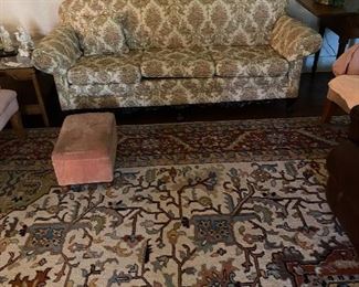 Living room: Palace size oriental rug, wood frame sofa, end tables, pairs of chairs