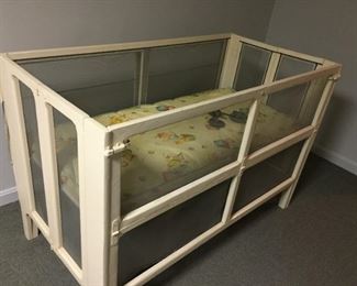Vintage crib with top screen.