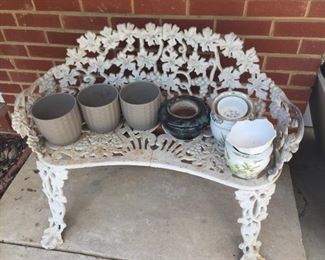 White metal chair and planters.