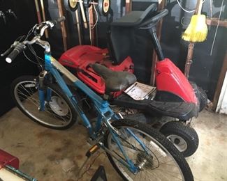 Bike and Troy Bilt riding tractor.