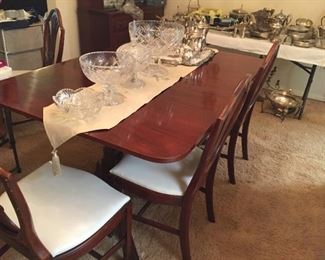 Dining room table (with leaves and covers) and chairs.